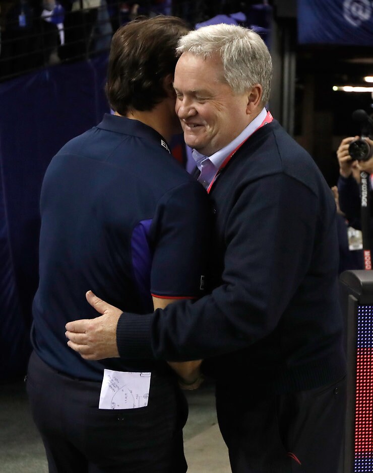 AFL 2016 Rd 21 - Western Bulldogs v Collingwood MELBOURNE, AUSTRALIA - AUGUST 12: Luke Beveridge, Senior Coach of the Bulldogs and President Peter Gordon (right) shake hands during the 2016 AFL Round 21 match between the Western Bulldogs and the Collingwood Magpies at Etihad Stadium on August 12, 2016 in Melbourne, Australia. (Photo by Michael Willson/AFL Media)